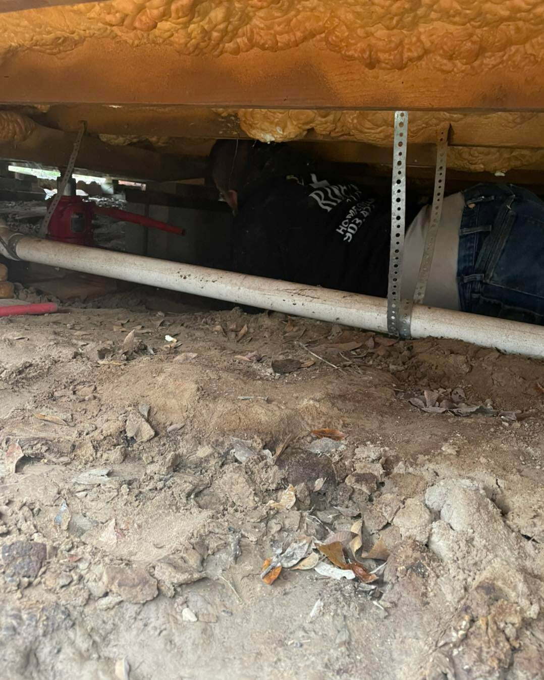 Risen Home Leveling worker under house