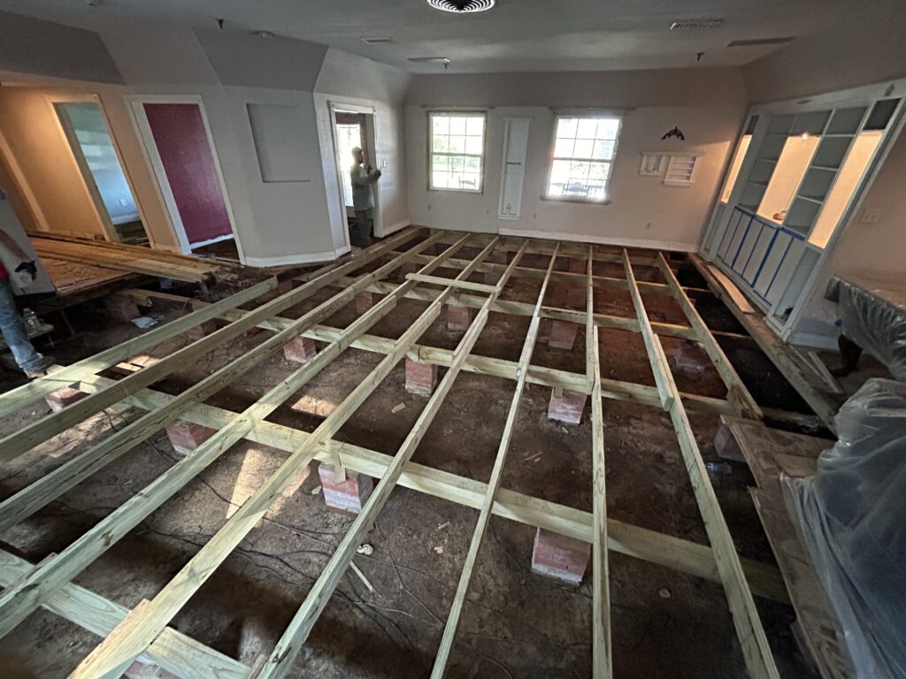 New subfloor framing installed to correct structural issues and prepare for floor leveling in an East Texas home.